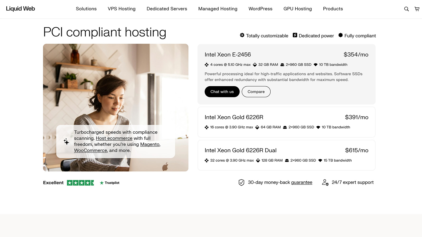 Liquid Web PCI-compliant hosting page showing server options, pricing, and features beside a woman using a laptop.